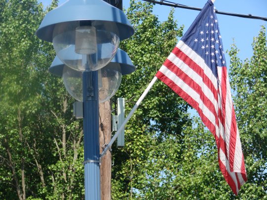 US Flags Mounted on historic light posts lining West Shore Road - Conimicut Village, Warwick, RI